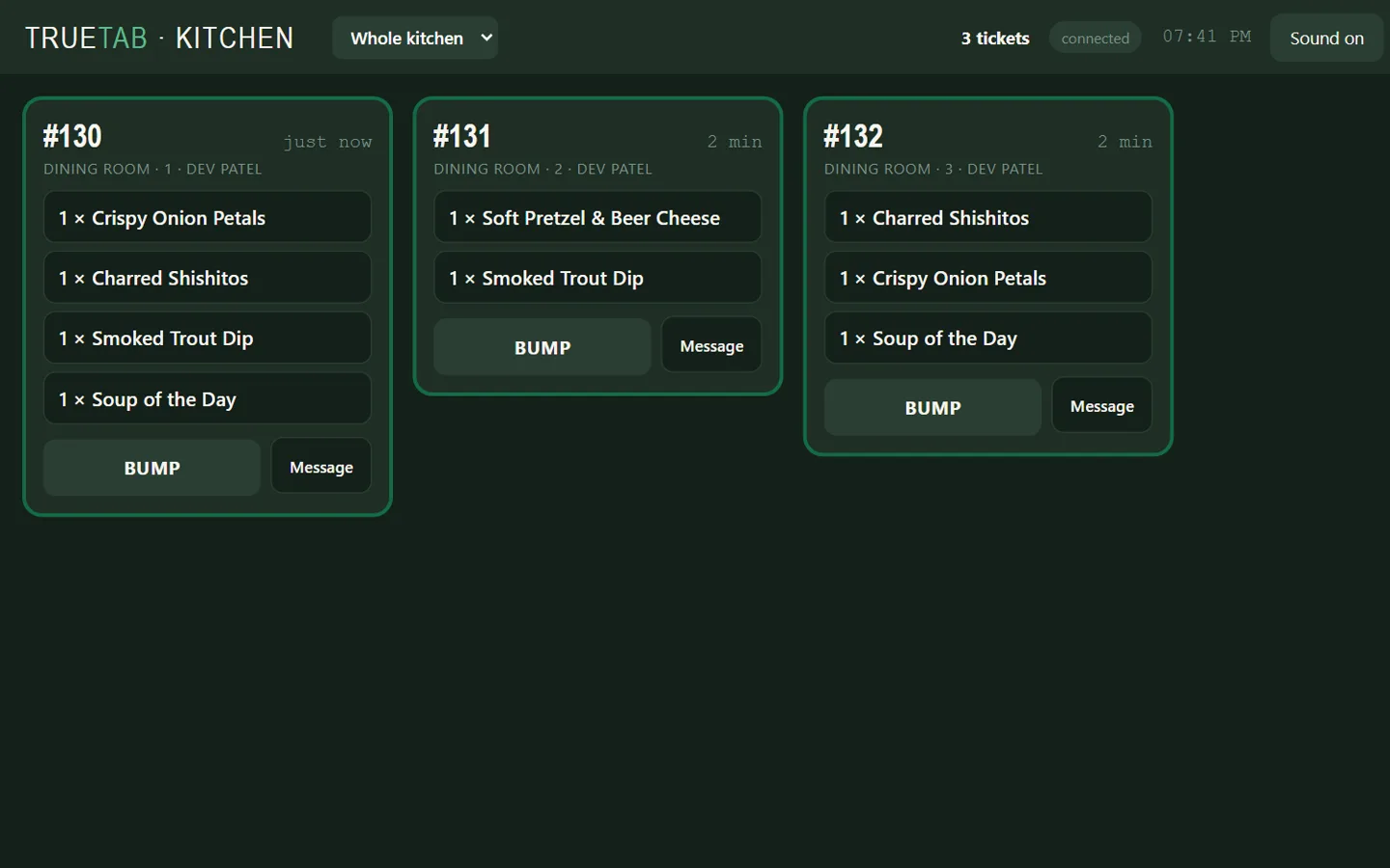 The TrueTab kitchen screen with three tickets from Dev's tables, sent just now.